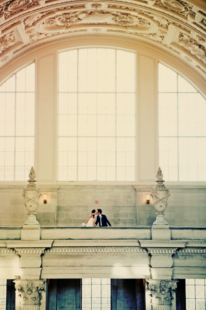 bride-and-groom-kissing-at-san-francisco-city-hall
