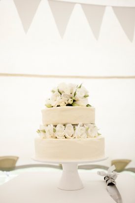 White wedding cake with roses