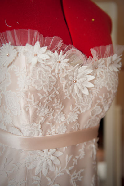 The pleated tulle and hand placed lace