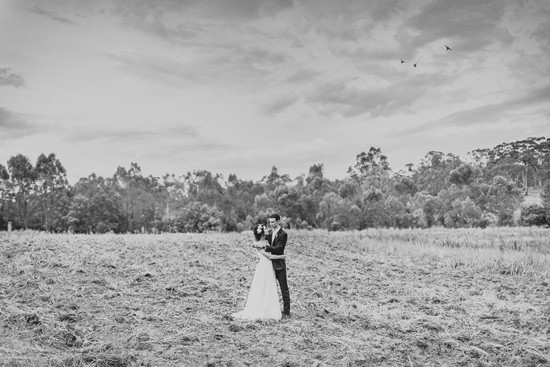 bride and groom in australian field