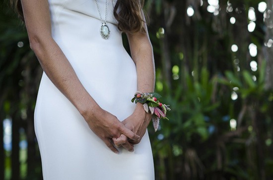 bride wearing wrist corsage