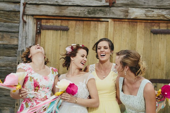 bride with bridesmaids in yelllow and mint