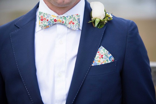 groom with floral bowtie