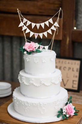 white wedding cake with butning