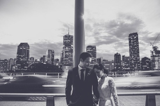 Bride and groom with brisbane cityscape