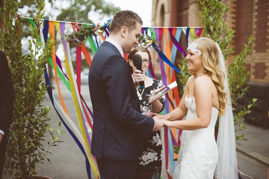Bride and groom with colourful streamers