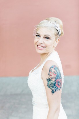 Bride with birdcage veil and tattoo