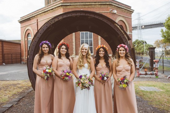 Bride with bridesmaids with multi coloured flower crowns