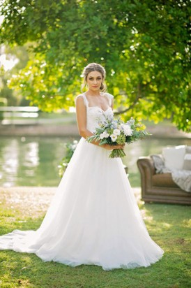 Bride with green and white bouquet