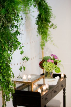 Ferns and green hydrangeas with candle