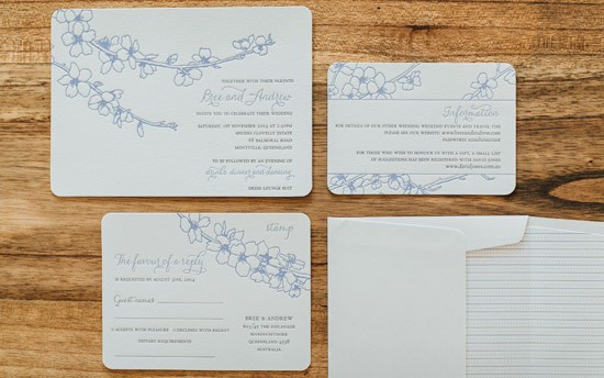 Letterpress wedding invitationd with blue flowers