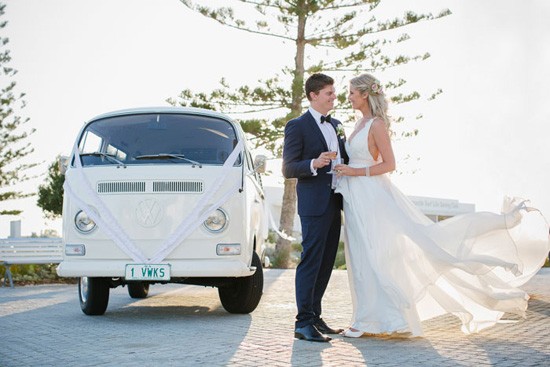 bride and groom with white kombi