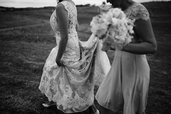 bride walking in lace wedding dress