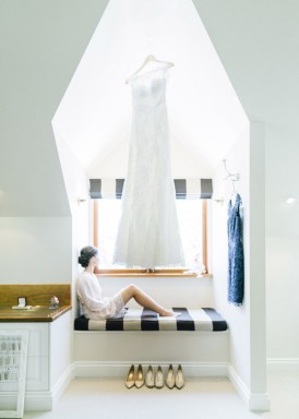 bride with her hanging dress