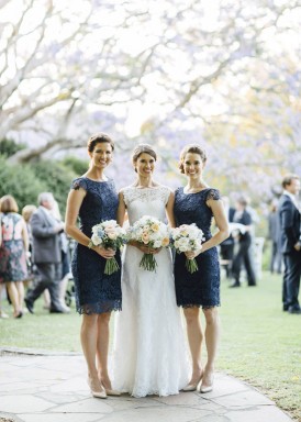 bride with navy bridesmaids