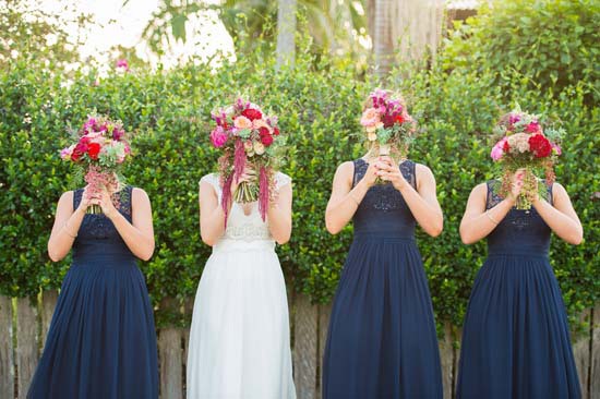 bridesmaid sin navy with pink and red bouquets
