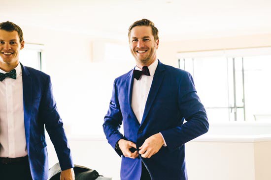 groom in blue jacket