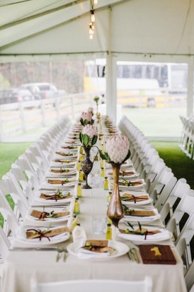 long wedding tables with brass vases