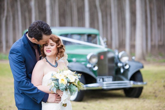newlyweds with vintage car