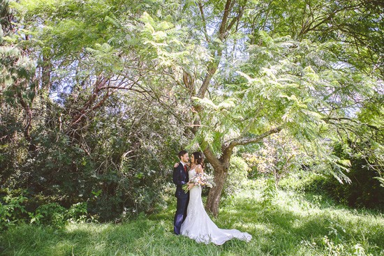 Bride and groom in gorgeous garden