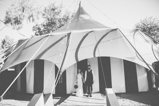 Bride and groom under tent