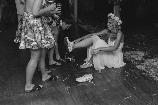 Bride changing into sneakers