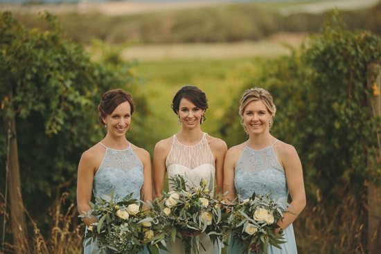 Bride with bridesmaids in pale blue