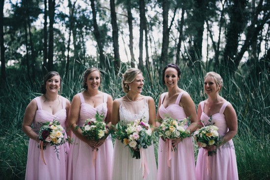 Bride with bridesmaids in pale pink