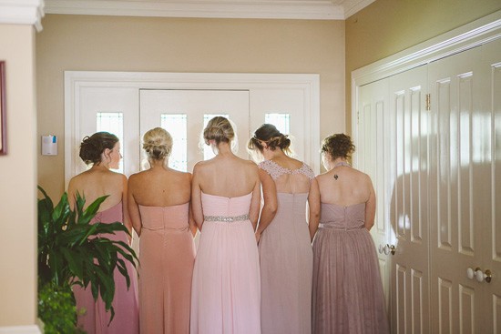 Bridesmaids in different pink dresses