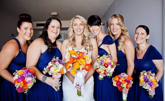 Bridesmaids in navy with poppies