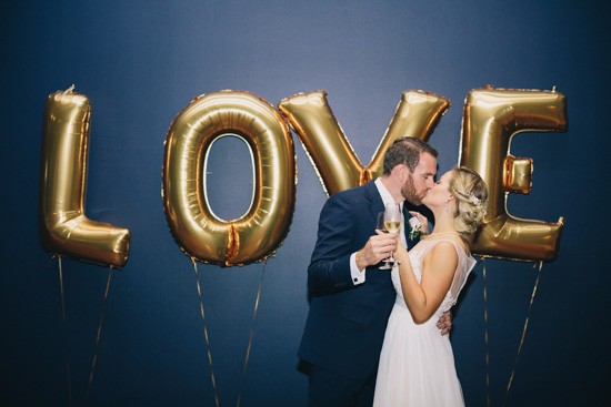 Gold foil love letters at wedding