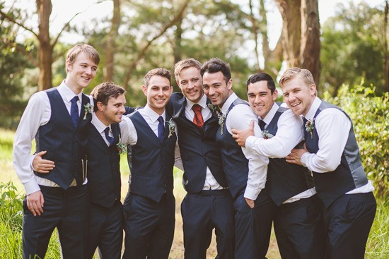 Groom and groomsmen in navy waistcoats