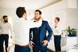 Groom outting on bowtie