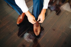 Groom with brown shoes and blue suit