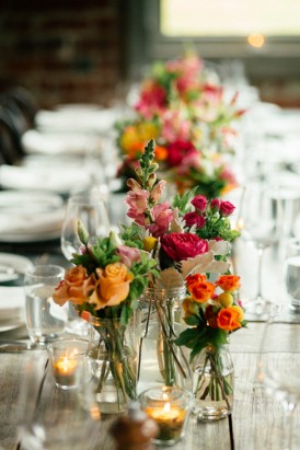 Red and orange wedding table flowers