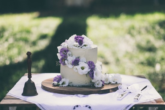 Wedding cake with puple and white flowers