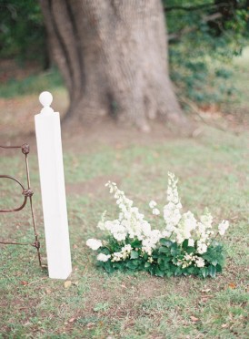 White with green wedding ceremony flowers