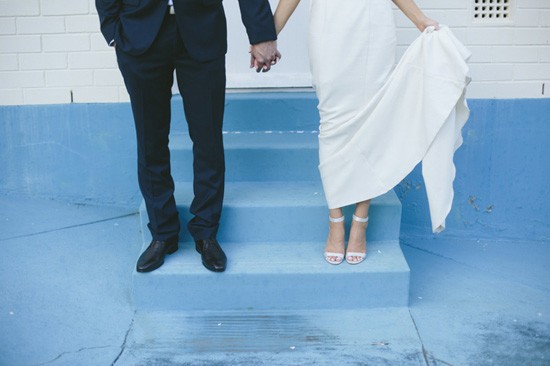 Bride and groom on blue steps
