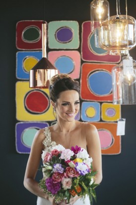 Bride in front of colourful wall