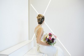 Bride in front of white wall
