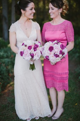 Bride with bridesmaid in hot pink