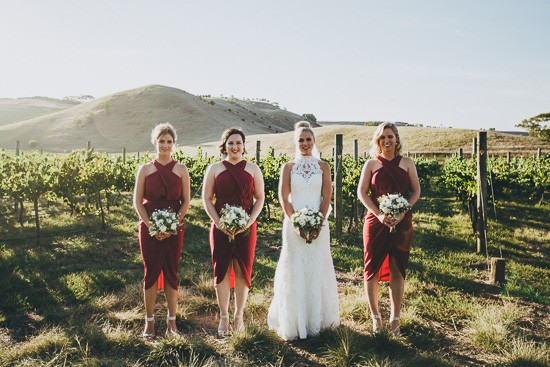 Bride with bridesmaids in red dresses