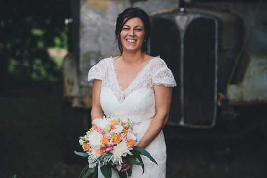 Bride with pink white and orange bouquet