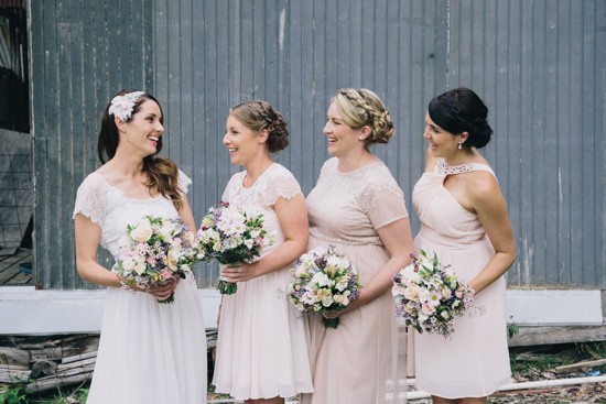 Bridesmaids in mismatched nude pink dresses