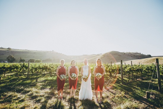 Country wedding with bridesmaids in red