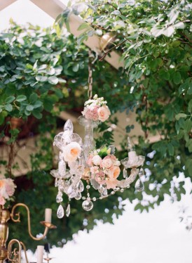 Crystal chandelier with peach roses