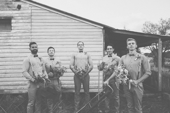 Groom and groomsmen with bouquets