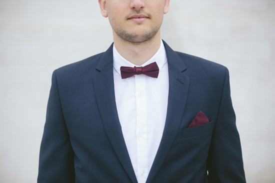Groom with burgundy bow tie