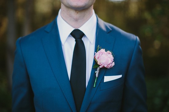 Groom with navy suit and black tie