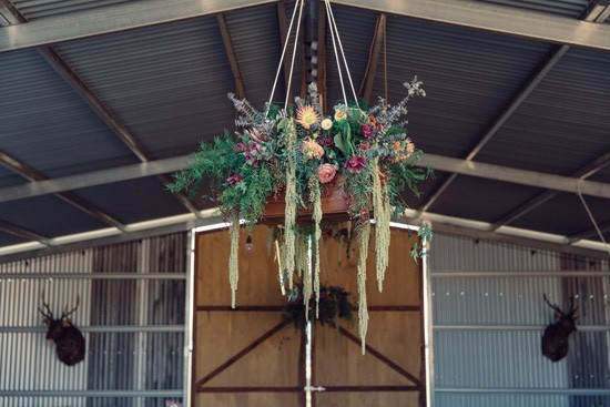 Hanging floral arrangement at country wedding